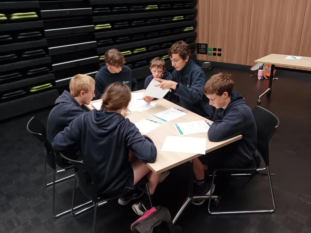 Denmark SHS students working through a problem together at the competition